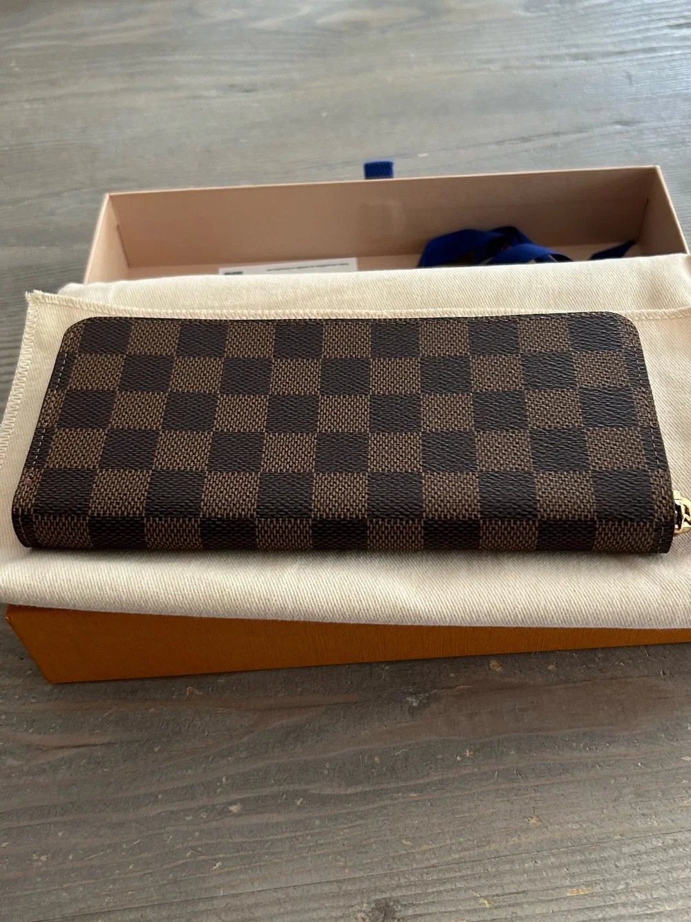 Authentic Louis Vuitton Damier Ebene Zip-Around Wallet with Red Leather Pull